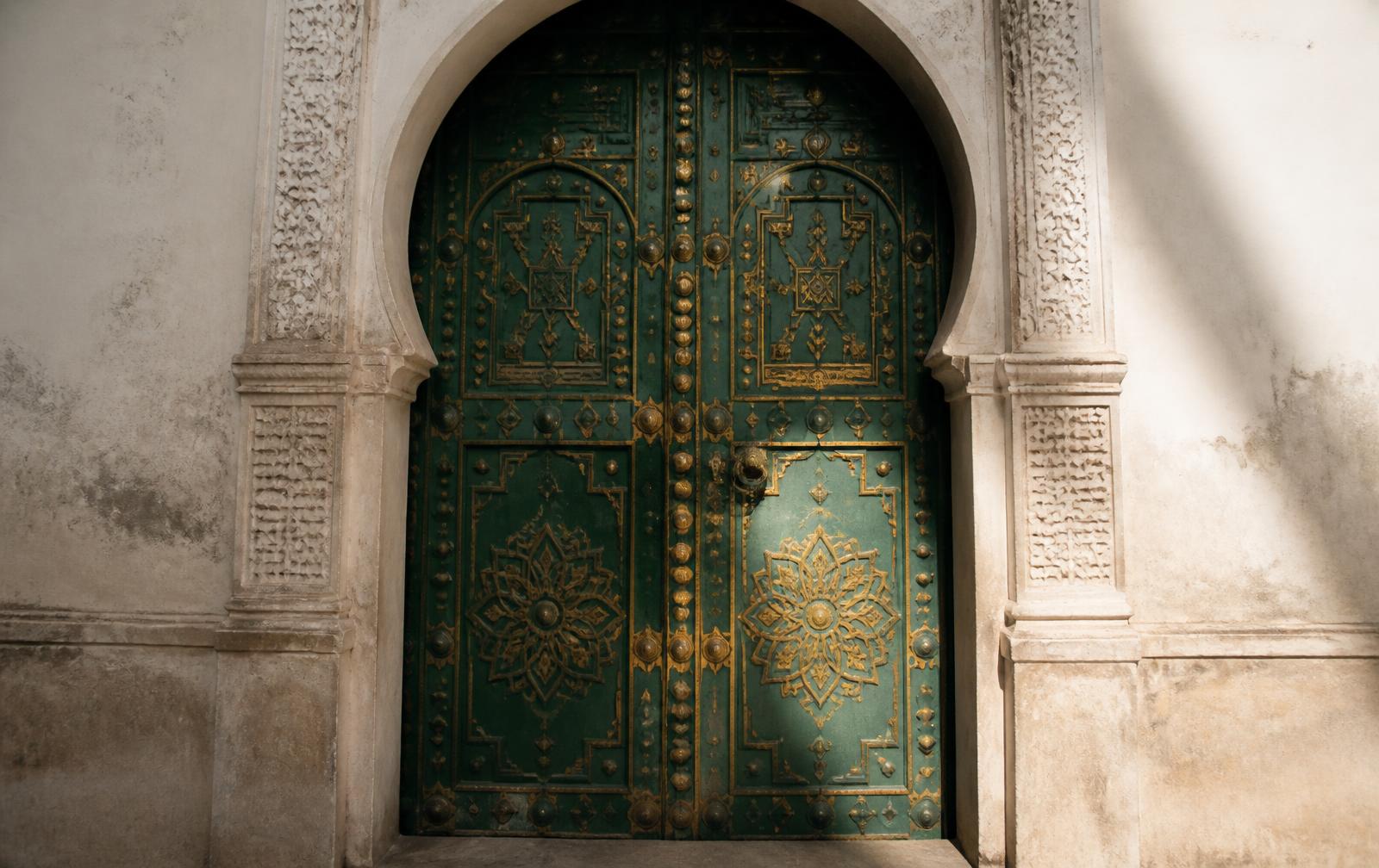 A carved emerald and gold traditional Algerian door
